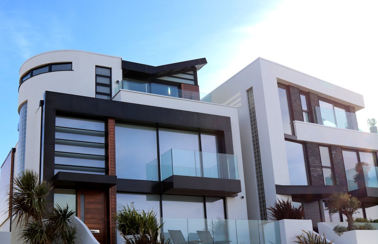 Home Contemporary luxury home with glass balconies in Poole, UK, showcasing modern architectural design.
